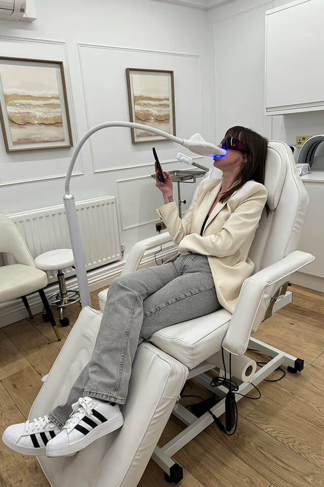 Woman receiving teeth whitening treatment